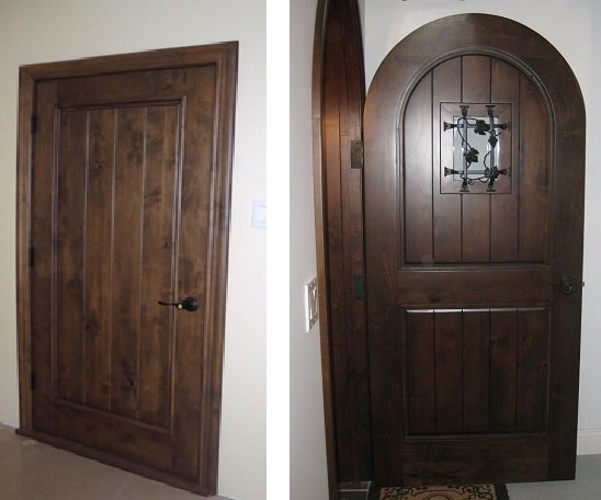 Elegantly designed wine cellar doors made from strong wood.